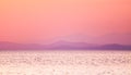 Sea sunset with mountains in the background - Soft focus Royalty Free Stock Photo