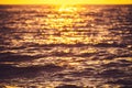 Sea sunset and ocean ripples waves as water texture background Royalty Free Stock Photo