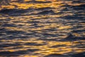 Sea sunset and ocean ripples waves as water texture background Royalty Free Stock Photo