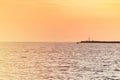 Sea sunset over pier, Beautiful seascape, Dreams of travel and freedom, Buoys at sea, Sundown sky and claim weather Royalty Free Stock Photo