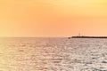 Sea sunset over pier. Beautiful seascape. Dreams of travel and freedom. Buoys at sea. Sundown sky and claim weather. Royalty Free Stock Photo