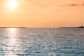 Sea sunset over pier. Beautiful seascape. Dreams of travel and freedom. Buoys at sea. Sundown sky and claim weather Royalty Free Stock Photo