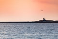 Sea sunset over pier. Beautiful seascape. Dreams of travel and freedom. Buoys at sea. Sundown sky and claim weather Royalty Free Stock Photo