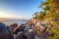 Sea sunset rocks beach on blue sky background. Beauty evening sunrise. Blue background.