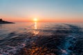 Sea sunset with ship trace Royalty Free Stock Photo