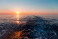 Sea sunset with ship trace Royalty Free Stock Photo