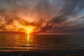 Sea sunset. Smoke wildfires sweeping across the sky