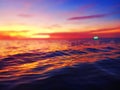 Sea sunset soft blurred background, ocean sunrise, tropical island beach dawn, dark blue water waves, colorful clouds sky Royalty Free Stock Photo