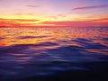 Sea sunset soft blurred background, ocean sunrise, tropical island beach dawn, dark blue water waves, colorful clouds sky Royalty Free Stock Photo