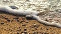 Sea surf foam sand on the beach close-up Royalty Free Stock Photo