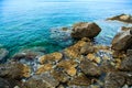 Sea surface, rocks on the beach close-up.