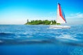 Sea surface summer wave background with sailboat.