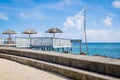 Sea swimming area and sun beach umbrellas by Piula Cave Pool, Up Royalty Free Stock Photo