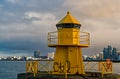 Sea transportation and navigation. Lighthouse on sea pier in reykjavik iceland. Lighthouse yellow bright tower at sea