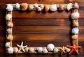 Sea travel frame decor with seashells and rope over wooden background Royalty Free Stock Photo