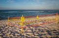 A sea turtle nest is blocked off from beach goers.