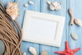 Sea vacation with blank photo frame, star fish and marine rope