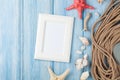 Sea vacation with blank photo frame, star fish and marine rope Royalty Free Stock Photo