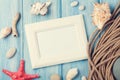 Sea vacation with blank photo frame, star fish and marine rope Royalty Free Stock Photo