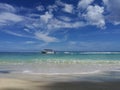 Sea view from beach on passing by boat