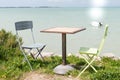 Sea view from empty romantic table and two chairs in island ile de re in france Atlantic ocean west coast Royalty Free Stock Photo