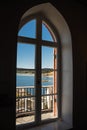 Sea view through the lighthouse arched window Royalty Free Stock Photo