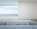 Sea view living room with white wall in modern house Royalty Free Stock Photo