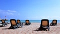 Sea view with lounge chairs on hotel sand beach