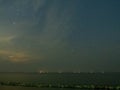 Sea view near mangrove forest with man made wooden barrier for wave protection, under starry nigh cloudy sky Royalty Free Stock Photo