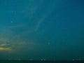 Sea view near mangrove forest with man made wooden barrier for wave protection, under starry nigh cloudy sky Royalty Free Stock Photo