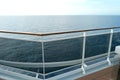 Sea view from the open deck of a modern cruise ship, railing and strong glass wall. Royalty Free Stock Photo