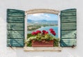 Sea view through the open window with flowers