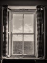 Sea View Out an Old Irish Window, with Shutters and Curtains in Black and White Royalty Free Stock Photo
