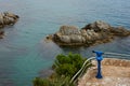 Sea view rocks and tourist telescope. Sea Rocks Telescope Lookout. Stationary binoculars, telescope, tower viewer or Royalty Free Stock Photo