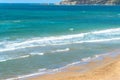 Sea view by the sandy beach against blueish sky in Kilyos, ship at the far end on the sea, Black Sea Region in Istanbul