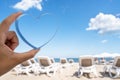 Sea view through shape of heart in the female hand of tropical beach. Valentines day. Holiday, vacation concept. Creative, backgro Royalty Free Stock Photo