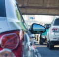 Sea view in side mirror of car with traffic jam Royalty Free Stock Photo