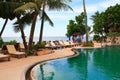 Sea view swimming pool, sun loungers next to the garden and beach of ocean