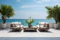 Sea view terrace or outdoor living room with sofa, tropical plants in luxury beach house or modern villa. Home interior, tropical Royalty Free Stock Photo