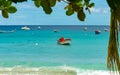 tropical beach with fisher boats