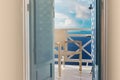 Sea view trough traditional wooden shutters on Santorini island, Oia, Greece. Balcony overlooking from a hotel romantic room.