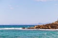 Sea view, turquoise blue sea water and rock. A beautiful blue lagoon on the coast Royalty Free Stock Photo