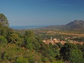 Sea view with village hill and green trees