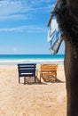 Sea view, wood chairs on the beach