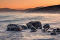 Sea washing over rocks at sunrise in Corsica Royalty Free Stock Photo