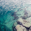 Sea water abstract background with stones Royalty Free Stock Photo