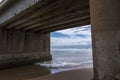 Sea Water Flowing into River at Low Tide under Railway Bridge Royalty Free Stock Photo