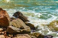 Sea water hits the stones on the beach