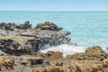 Sea water hitting the rocks on the bay