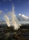 Sea water jets on Cadiz coastline rocks, Spain